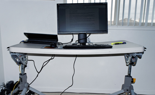 Photograph of sagging plastic table used as a desk top for Peter Free article showing how to replace it with a solid core door.